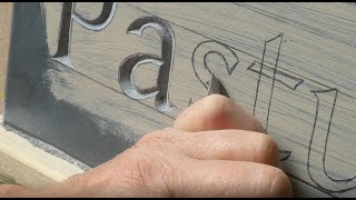 Stone carver carving lettering on slate [upl. by Nadaba]